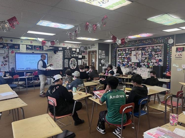 Dr. Villarreal speaking with students