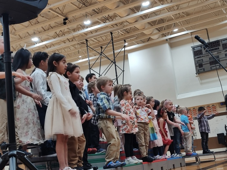 students on bleachers at concert
