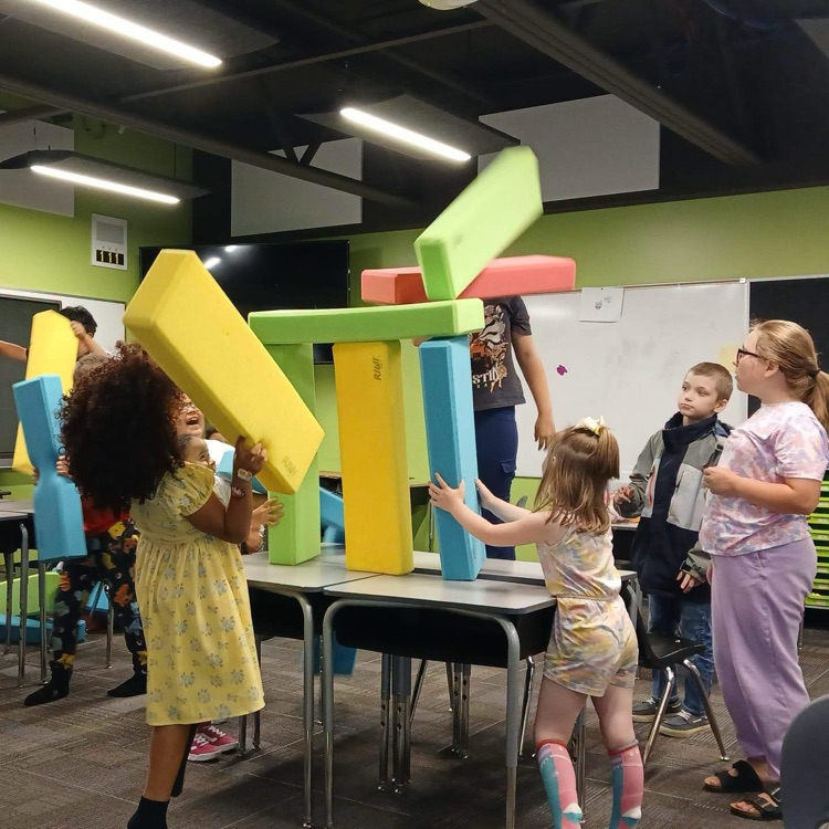students building giant blocks inside