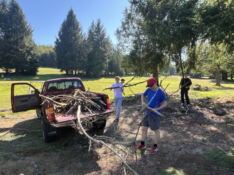 golfers at work doing grounds cleanup