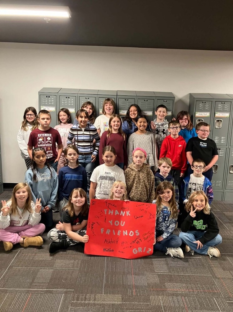 students with thank you poster