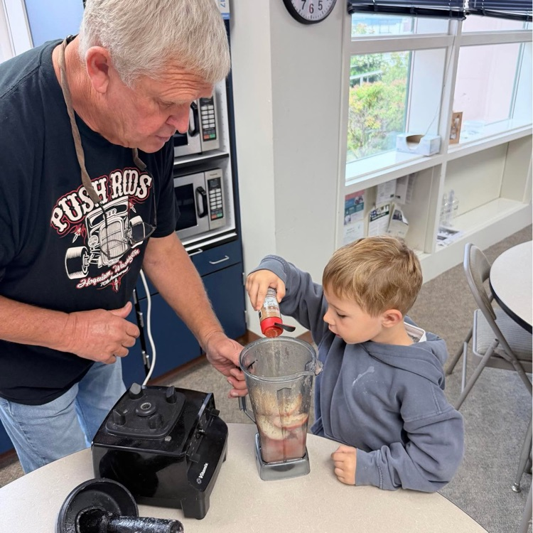 apple sauce making with volunteers