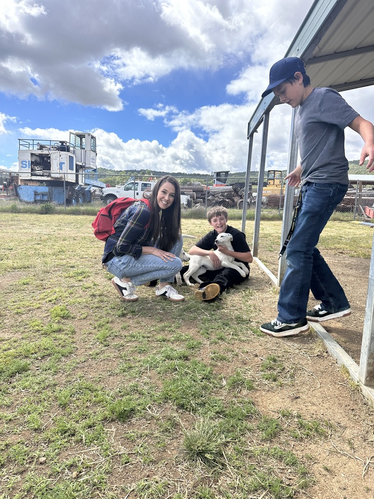 Student holding a puppy. 