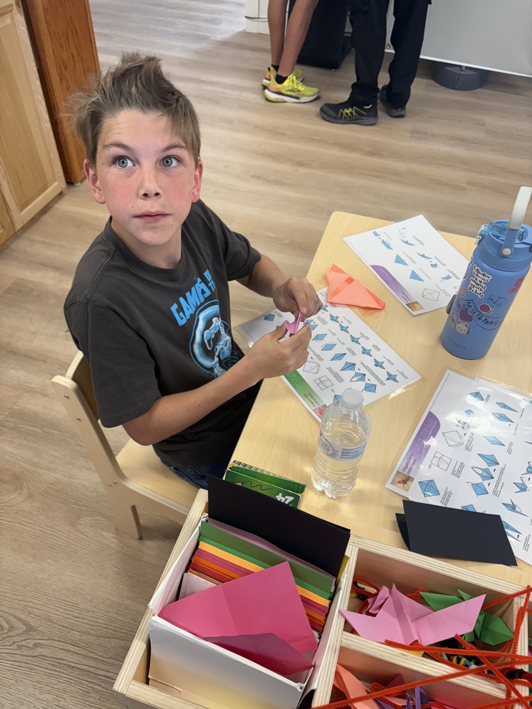 Student making origami. 