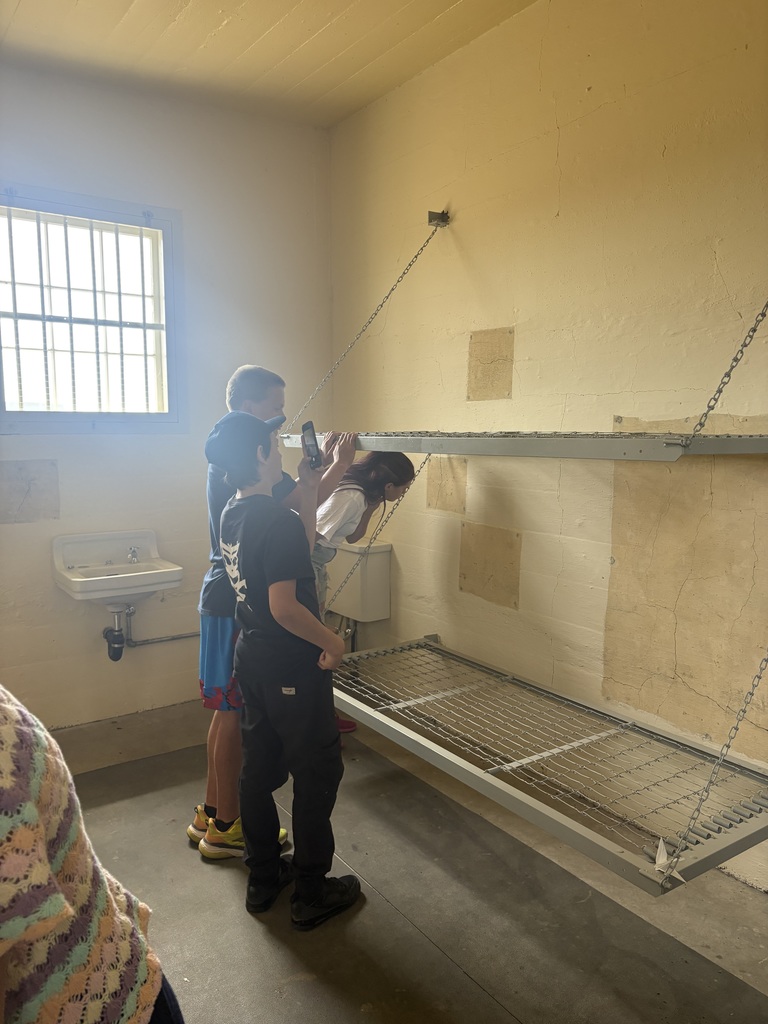 Students looking around in the jail. 