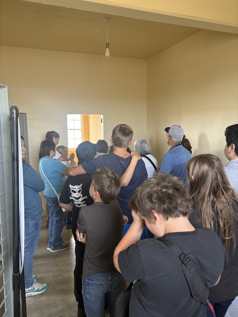 Students gathered listening to the speaker. 