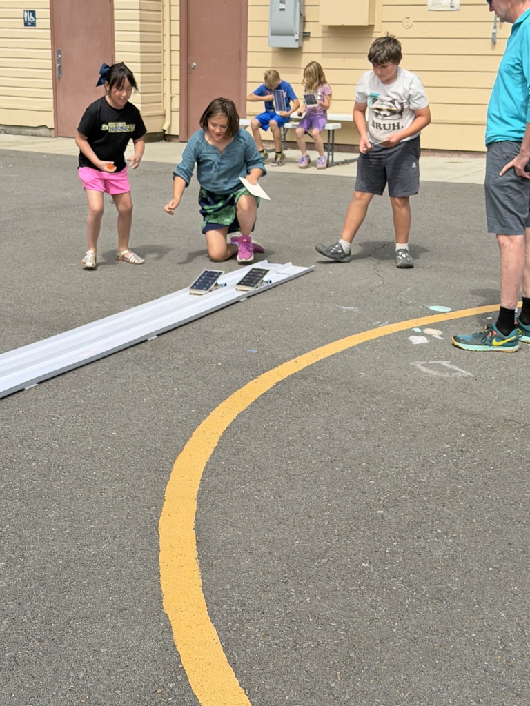 Students racing solar cars. 