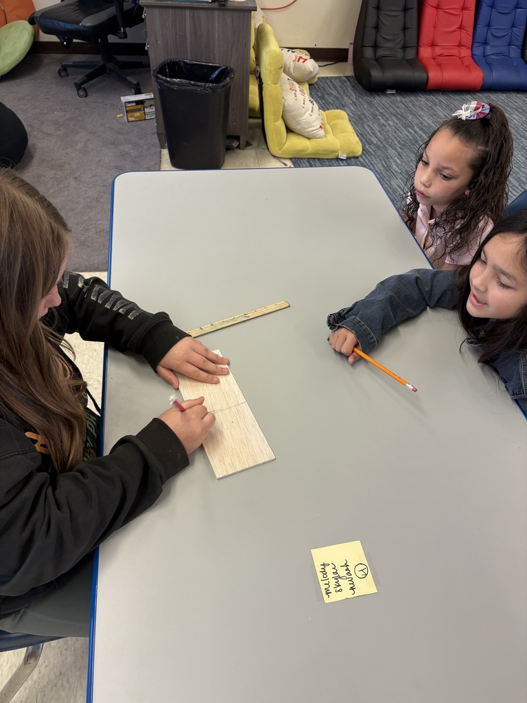 Students at a desk.