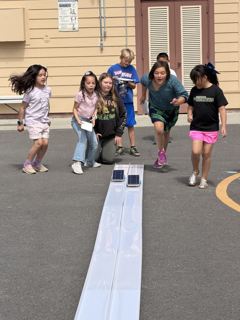 Students racing solar cars. 