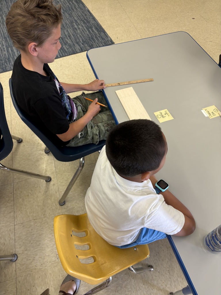 Students at a desk.