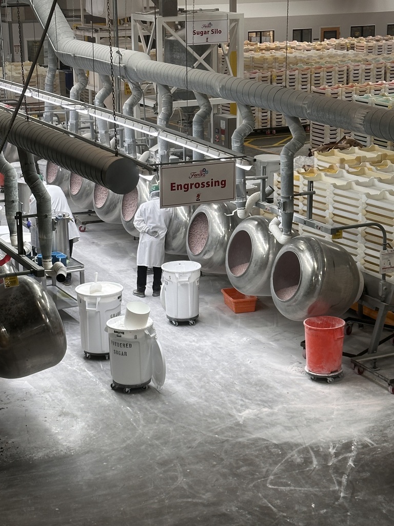Inside the Jelly Belly Factory with drums of Jelly Beans being made. 