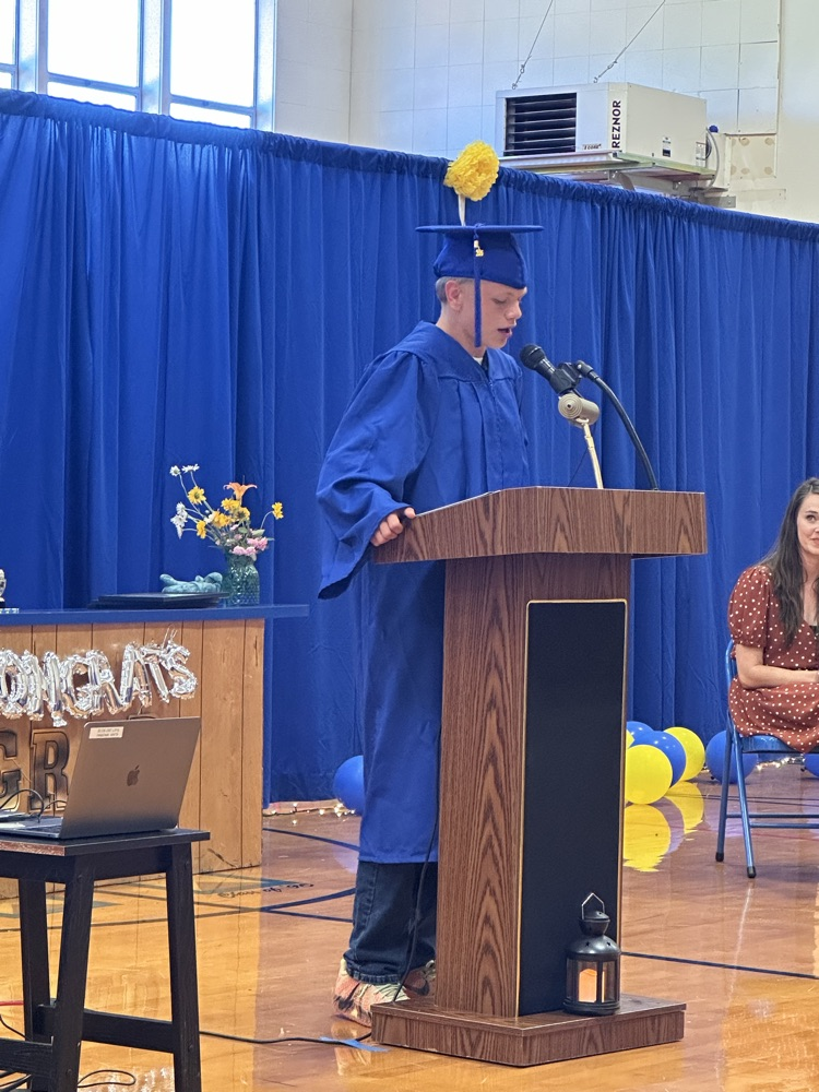 student at the podium speaking
