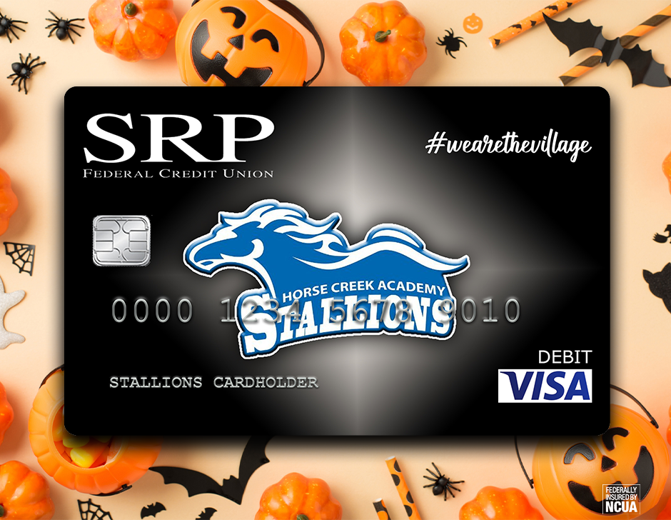 A credit card with a horse logo and "Stalions" text displayed on a Halloween-themed background with pumpkins and bats.