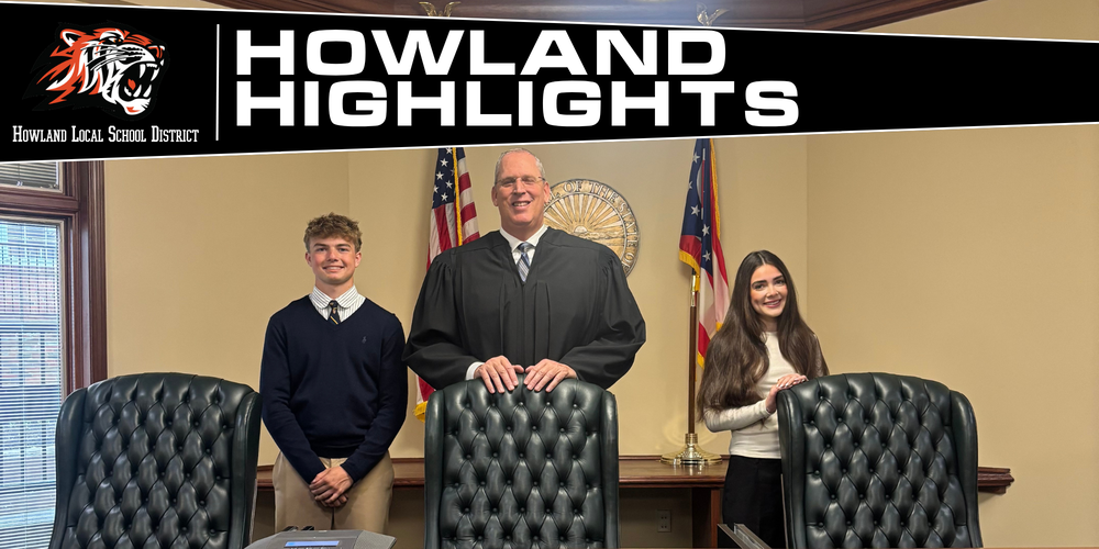 Howland students Justin Keating and Sophia McGarritty pose with judges during Law Day activities at the Eleventh District Court of Appeals.