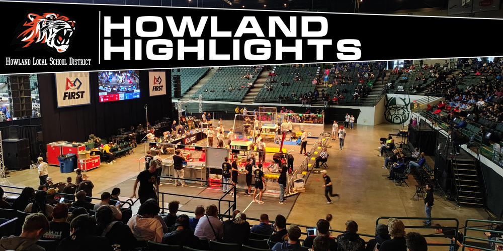 Robotics team working on a robot during a competition.