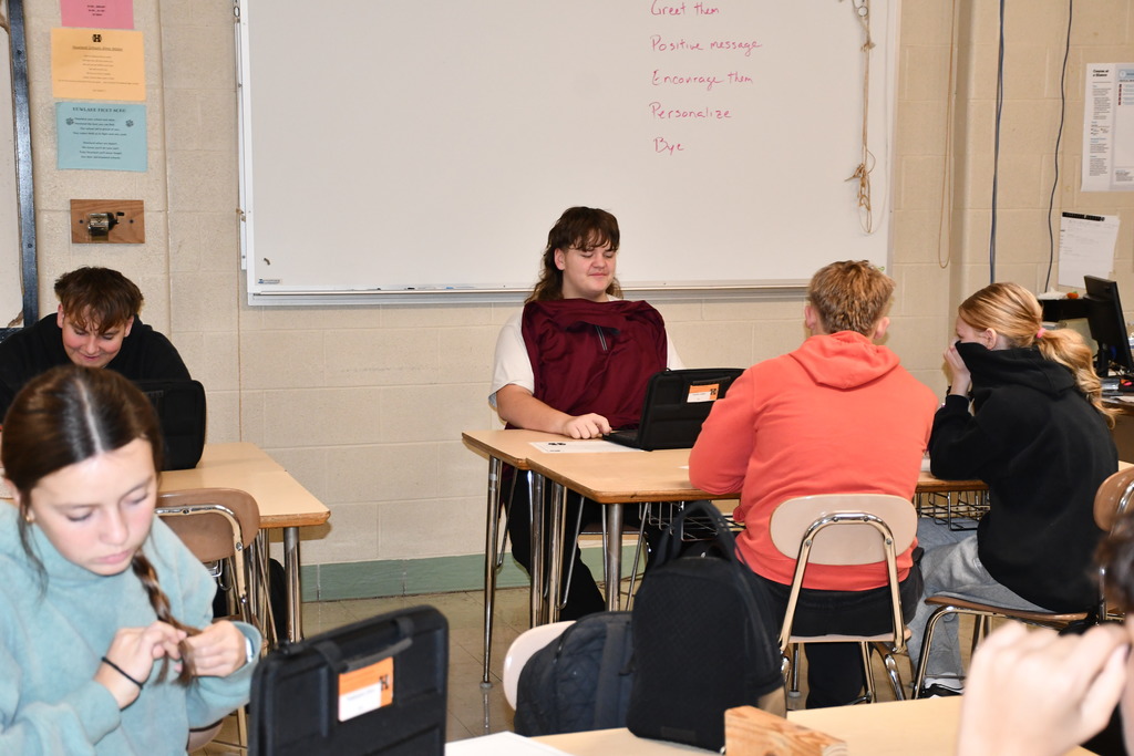 High school students write affirmation postcards