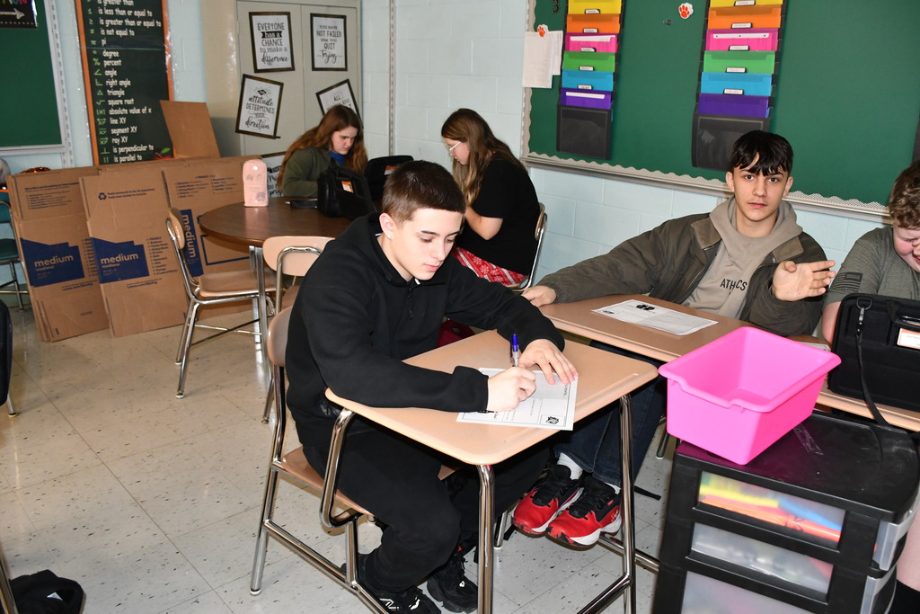 High school students write affirmation postcards