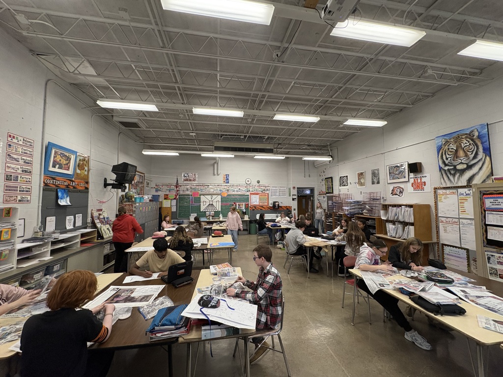 Eighth graders creating cultural paper-mâché masks