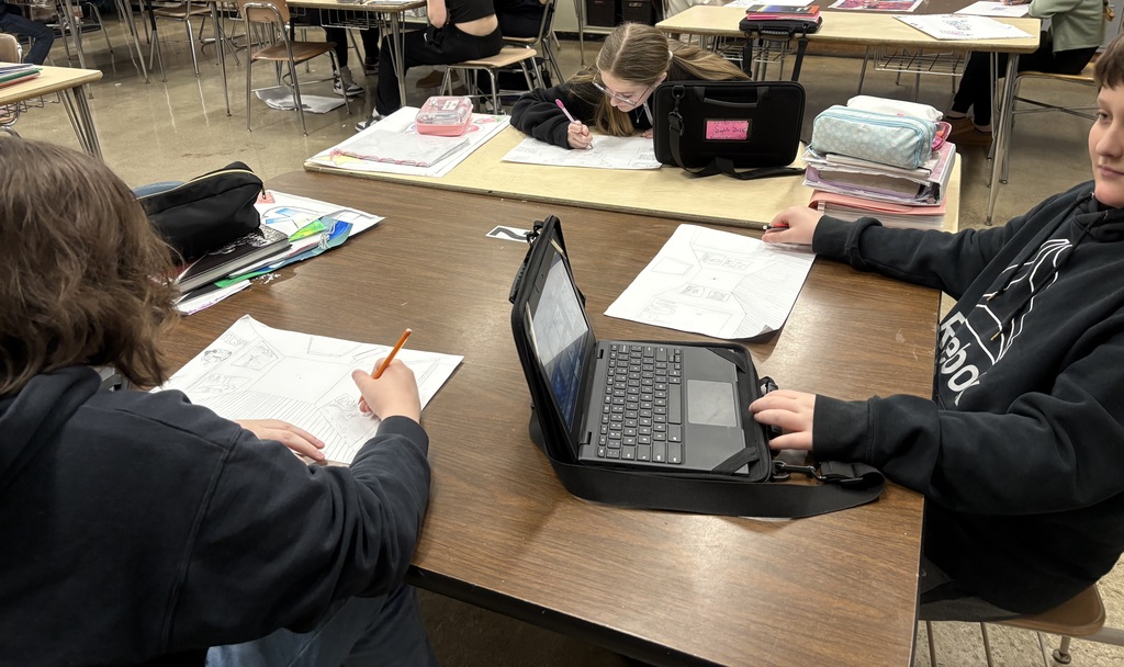 Seventh graders drawing one-point perspective galleries