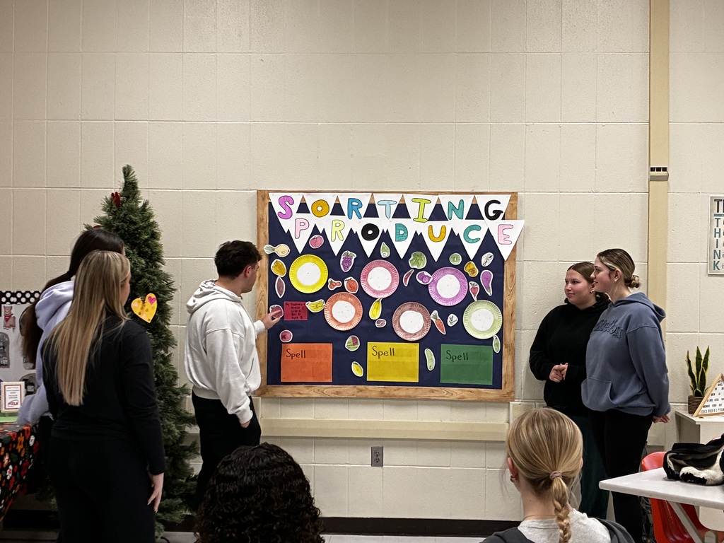 Students presenting bulletin board