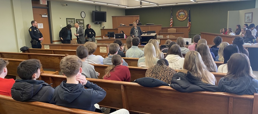 Judge speaking to students