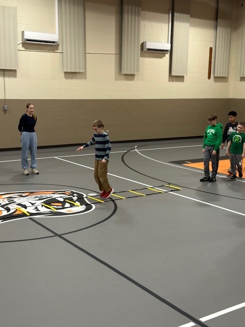 Students running with cross country team