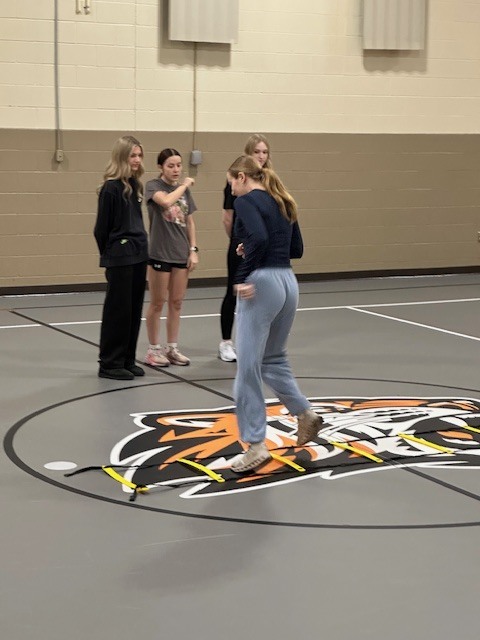 Students running with cross country team