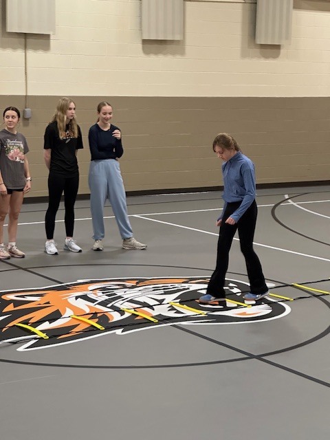 Students running with cross country team