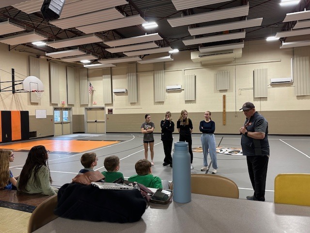 Students running with cross country team