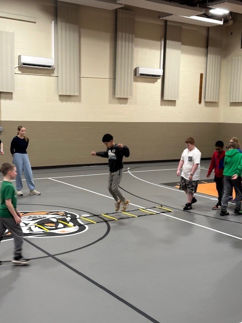 Students running with cross country team