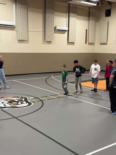 Students running with cross country team