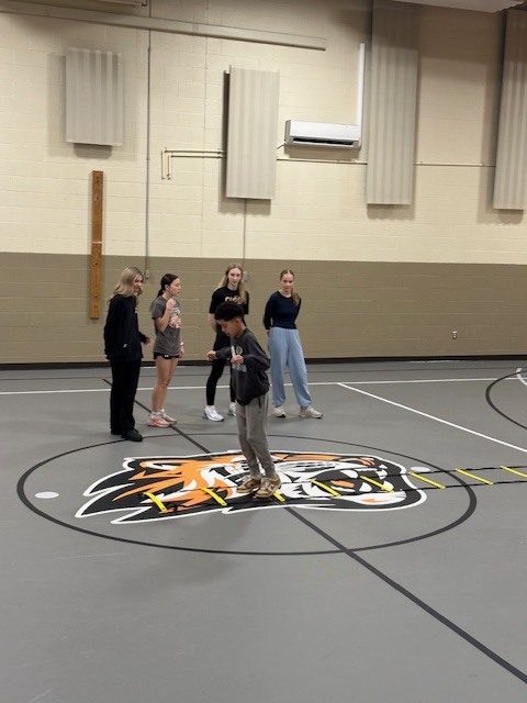 Students running with cross country team