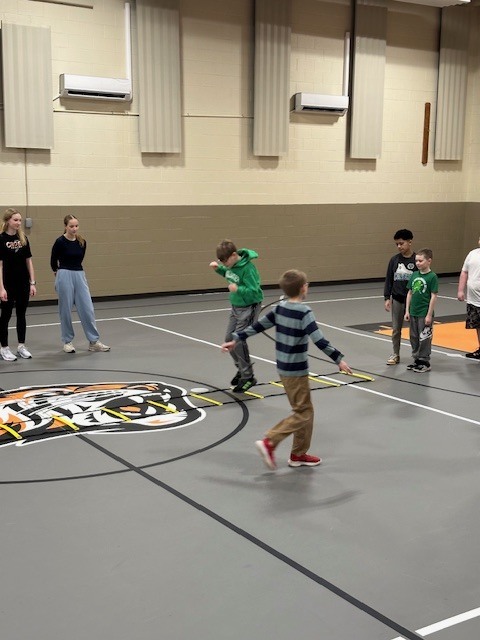 Students running with cross country team