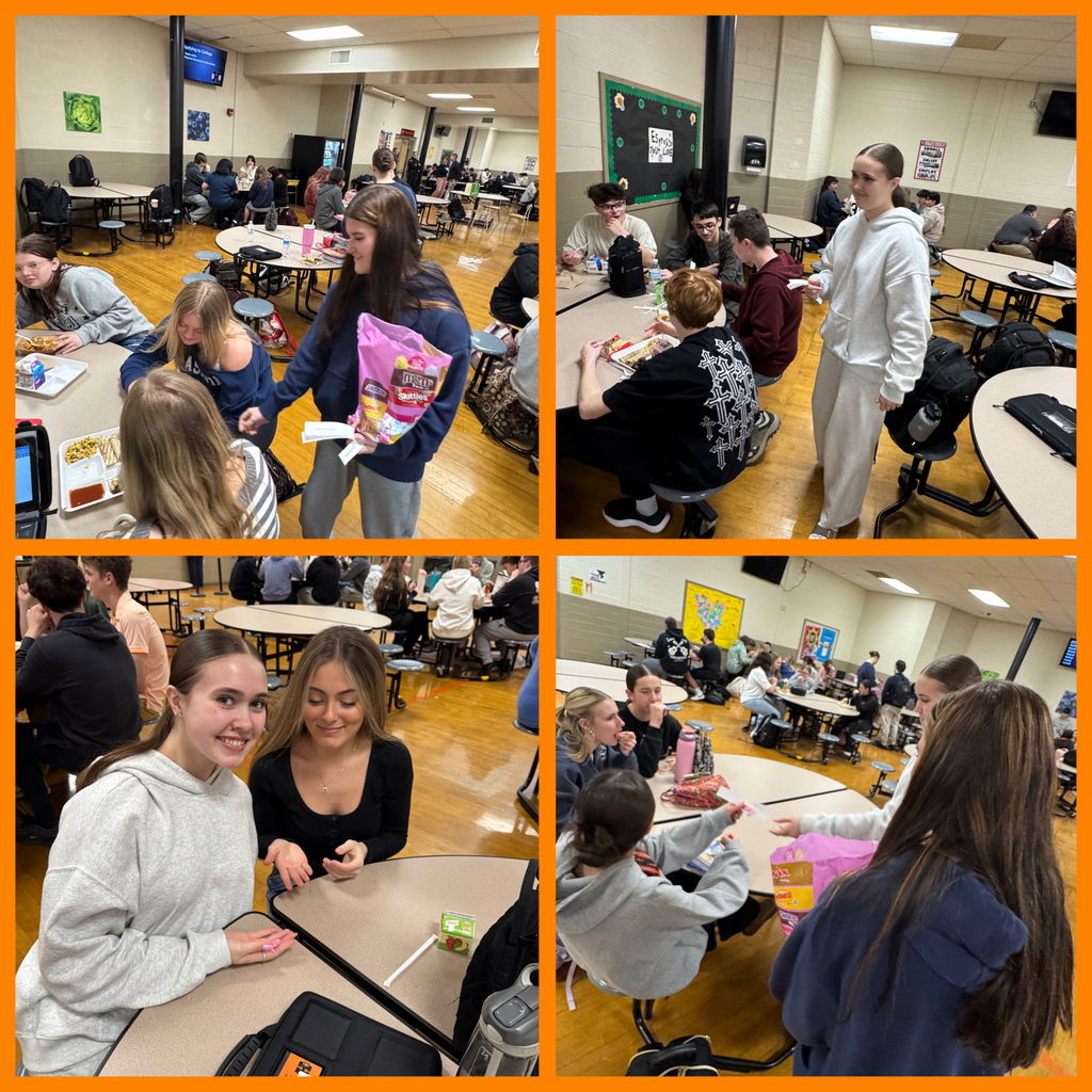 Students handing out notes and treats to staff members.