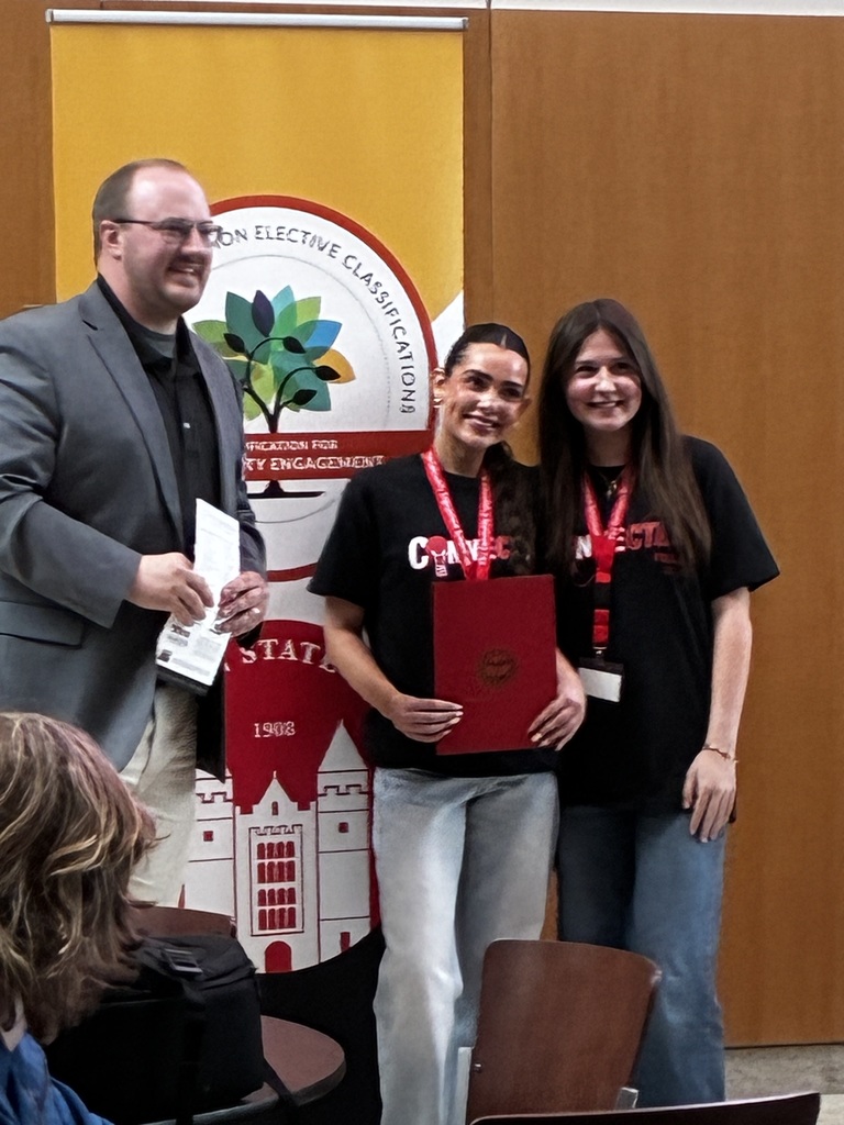  Two students receiving award at YSU Community Engagement Symposium