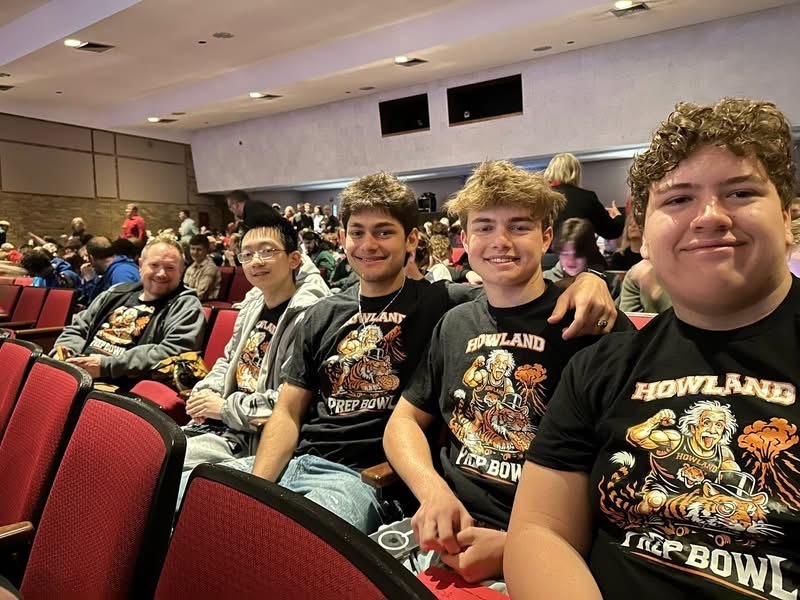  High school students seated at an academic quiz competition