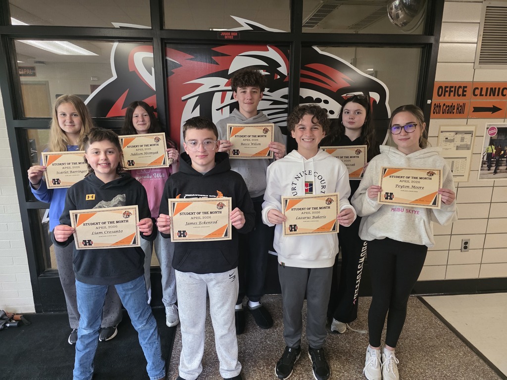 april students of the month hold up their certificate of recognition