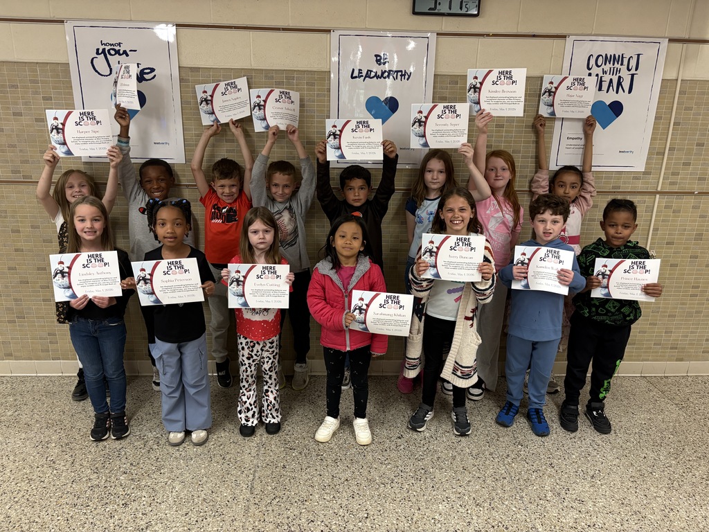 april students of the month hold up their certificate of recognition