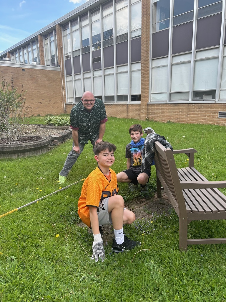 Students from Howland Intermediate School’s Science Club work together in the courtyard at Howland Middle School as part of an Earth Day beautification project.