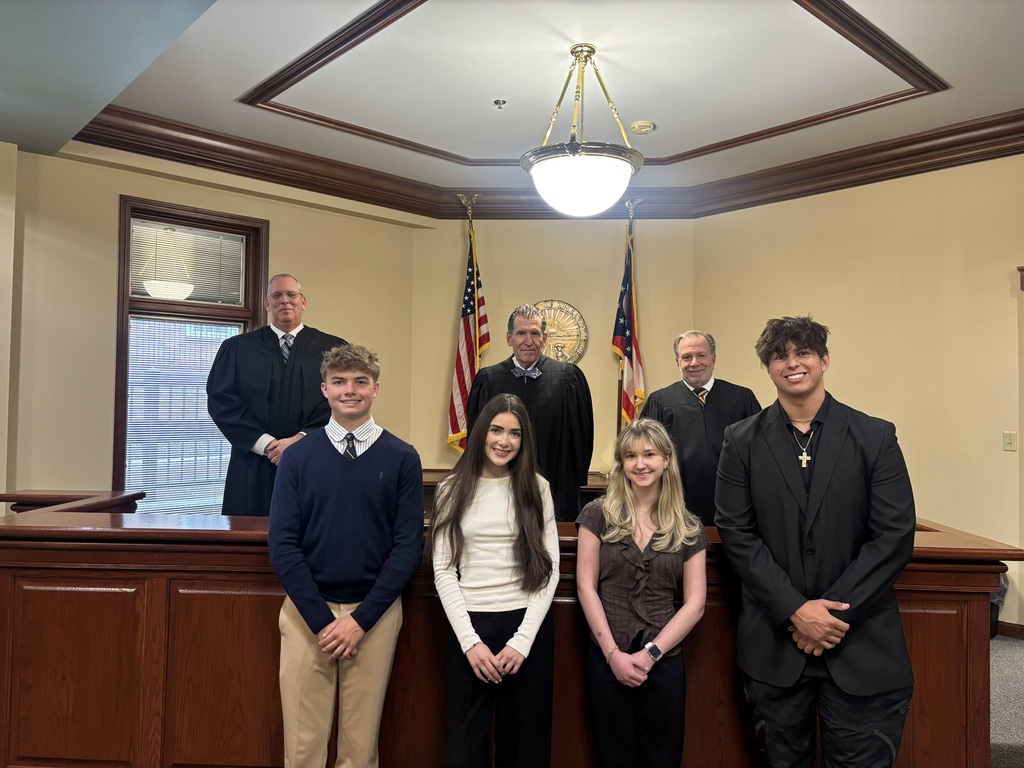 Howland students Justin Keating and Sophia McGarritty pose with judges during Law Day activities at the Eleventh District Court of Appeals.