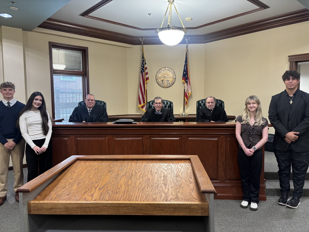 Howland students Justin Keating and Sophia McGarritty pose with judges during Law Day activities at the Eleventh District Court of Appeals.