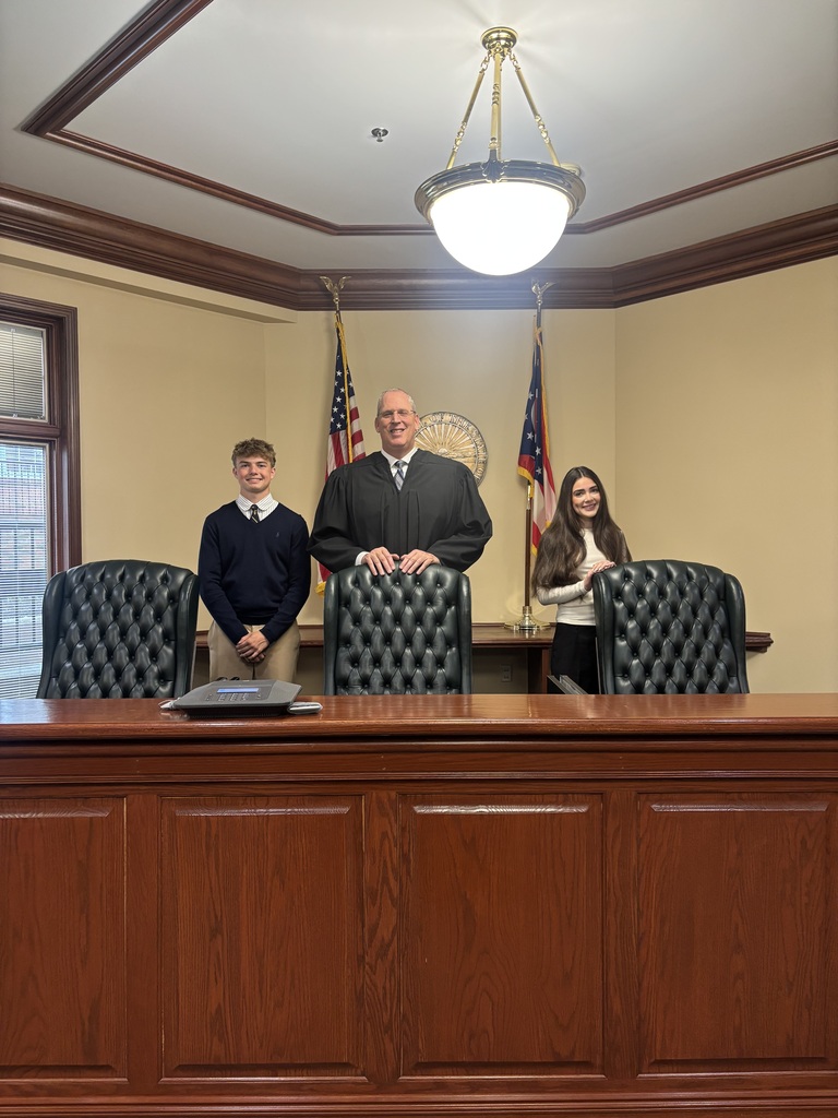 Howland students Justin Keating and Sophia McGarritty pose with judges during Law Day activities at the Eleventh District Court of Appeals.