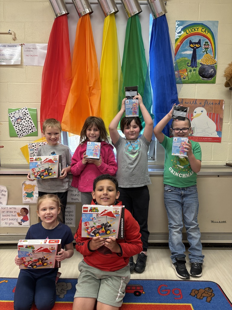 Top student sellers from Glen Primary School’s Philadelphia Candy fundraiser pose with prizes and Chick-fil-A meals alongside Principal Roth.