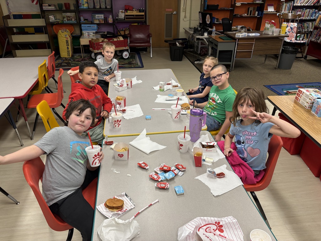 Top student sellers from Glen Primary School’s Philadelphia Candy fundraiser pose with prizes and Chick-fil-A meals alongside Principal Roth.
