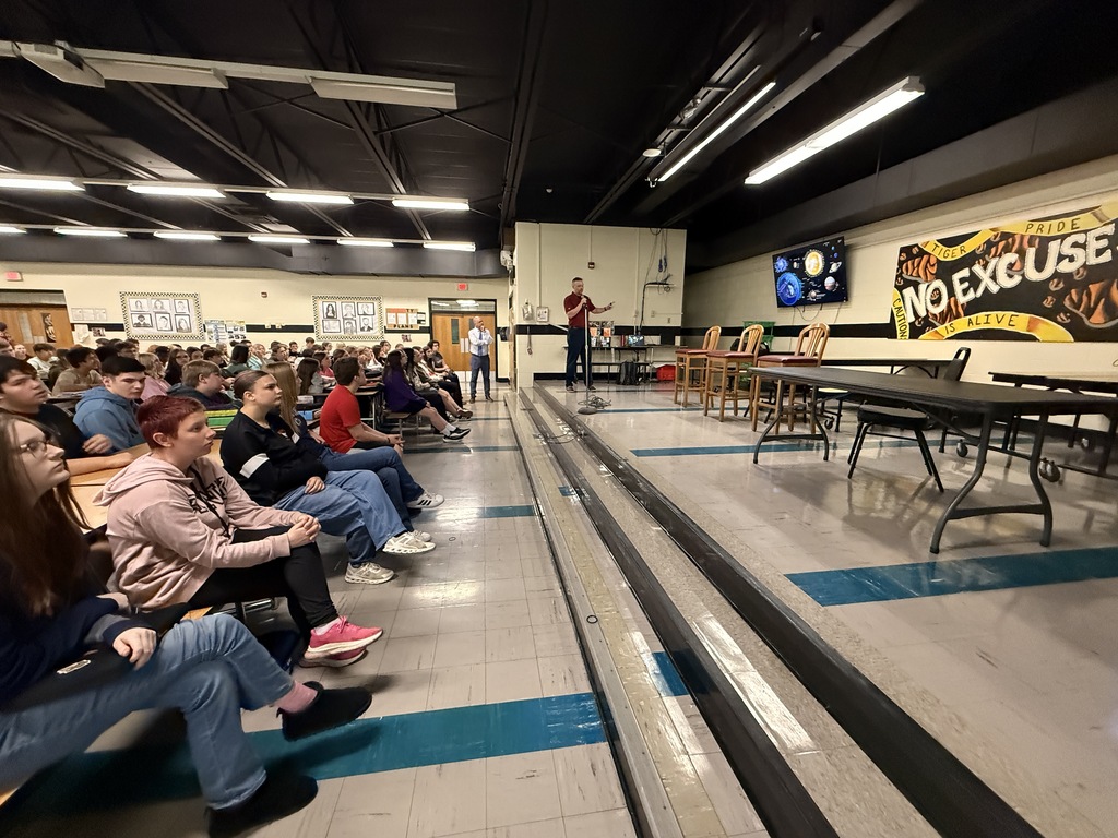 Space-themed graphic announcing a NASA presentation for Howland Junior High students featuring NASA engineer Patrick Barnes
