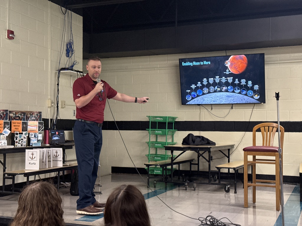 Space-themed graphic announcing a NASA presentation for Howland Junior High students featuring NASA engineer Patrick Barnes