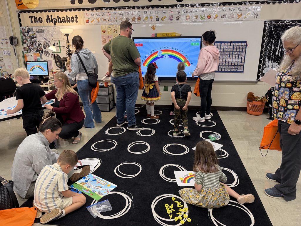 Kindergarten students and their families participate in hands-on literacy activities during Fall Family Literacy Night at Howland Springs Primary School.