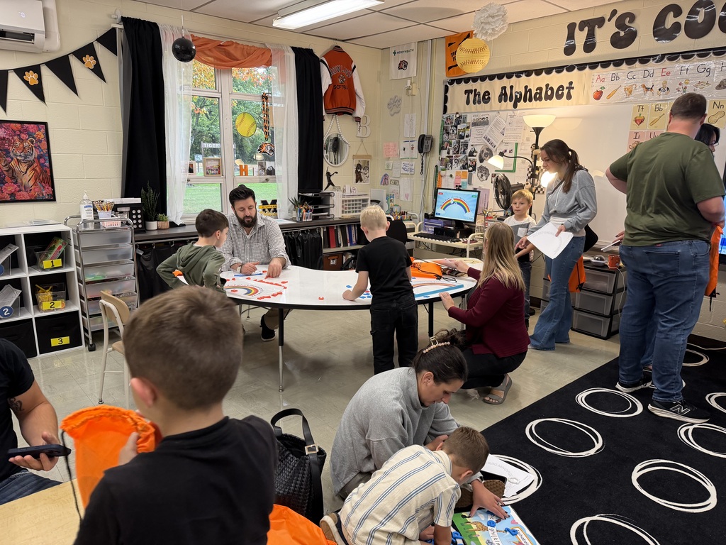 Kindergarten students and their families participate in hands-on literacy activities during Fall Family Literacy Night at Howland Springs Primary School.