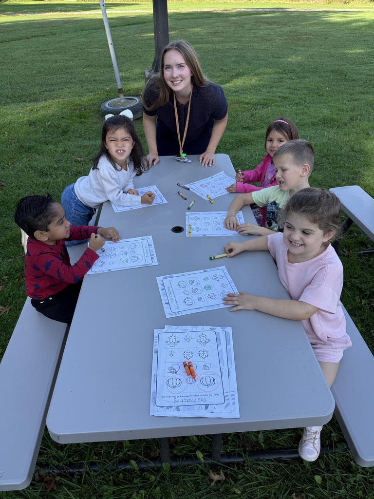 Howland Springs preschool children participate in outdoor storybook activities inspired by The Acorn and the Oak, exploring letters, acorns and tree growth.