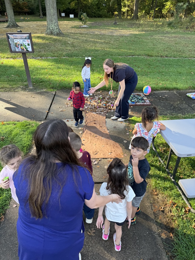 Howland Springs preschool children participate in outdoor storybook activities inspired by The Acorn and the Oak, exploring letters, acorns and tree growth.